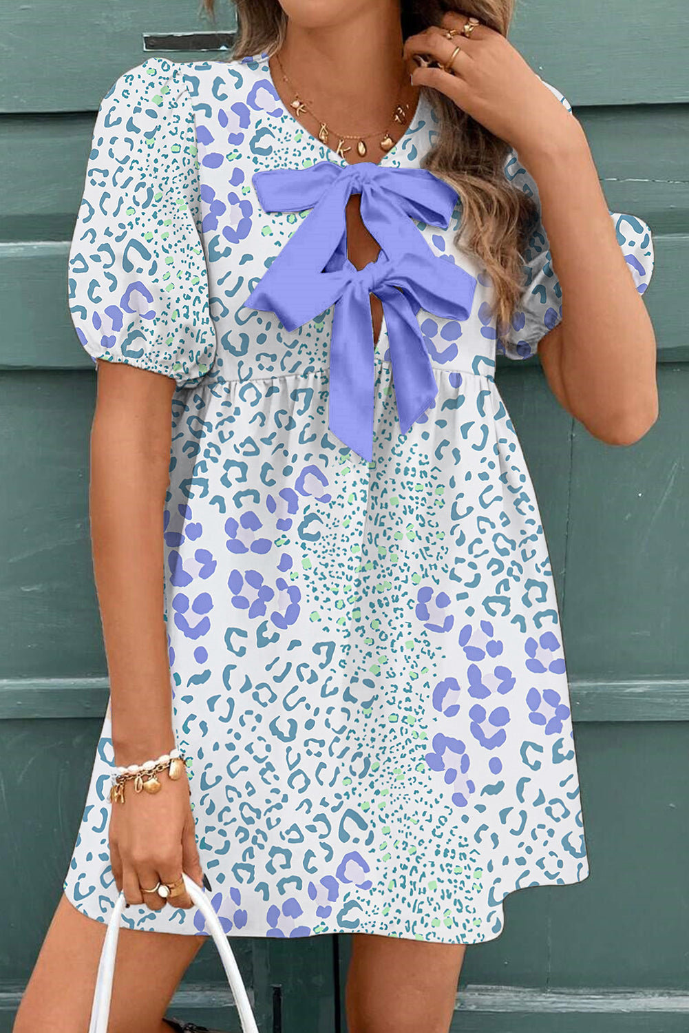 Sky blue floral contrast bow puff sleeve mini dress by Mommas Hive, featuring a fitted silhouette and charming puff sleeves.