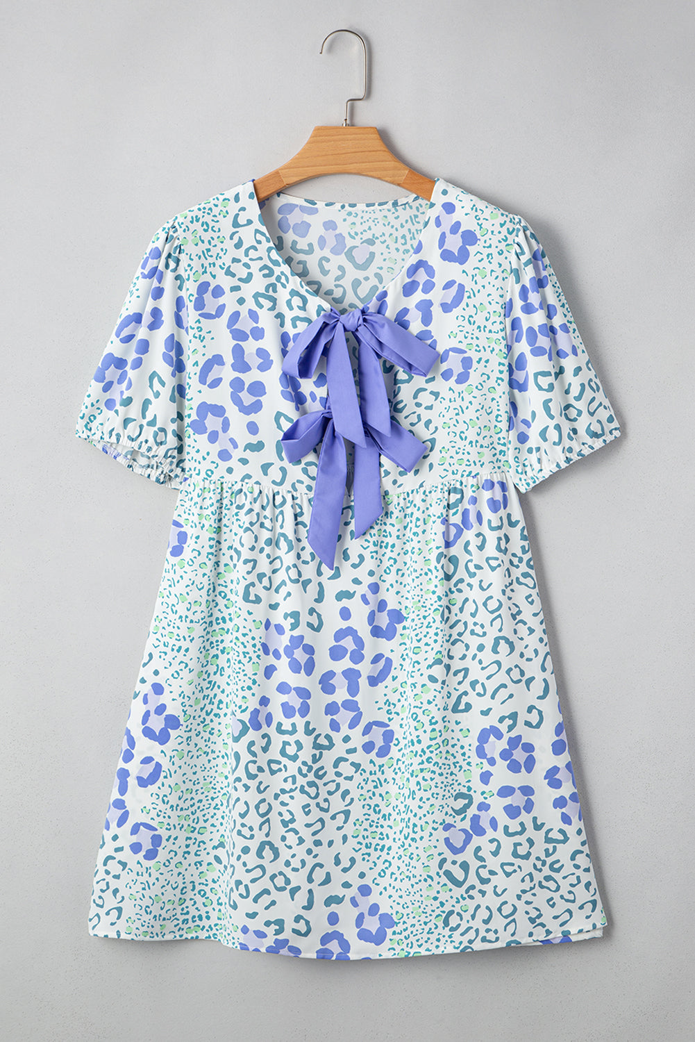 Sky blue floral contrast bow puff sleeve mini dress by Mommas Hive, featuring a fitted silhouette and delicate floral pattern.