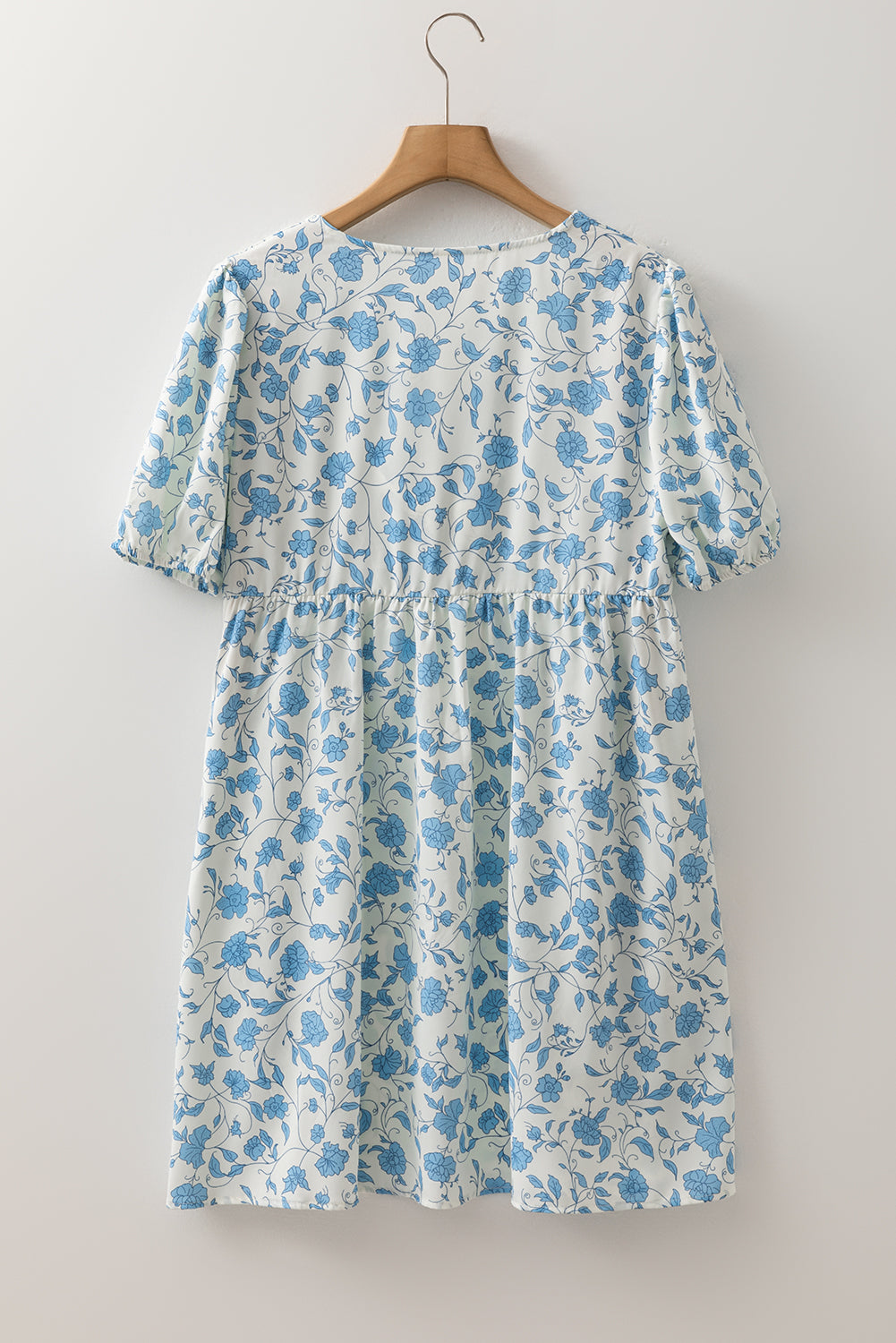 Sky blue floral contrast bow puff sleeve mini dress by Mommas Hive, featuring a fitted silhouette and delicate floral pattern.