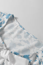 Sky blue floral contrast bow puff sleeve mini dress by Mommas Hive, featuring a fitted silhouette and delicate floral print.