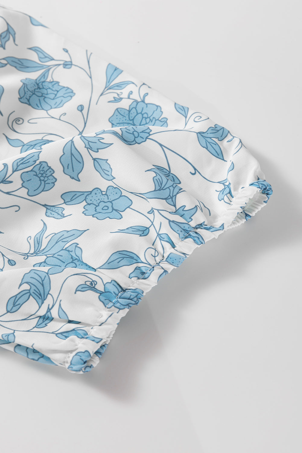 Sky blue floral contrast bow puff sleeve mini dress by Mommas Hive, featuring a fitted silhouette and feminine details.