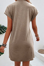 Light French beige T-shirt dress with center seam and rolled cuffs by Mommas Hive, casual and comfortable for everyday wear.