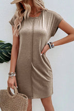 Light French beige T-shirt dress by Mommas Hive featuring center seam and rolled cuffs, casual and comfortable for everyday wear.