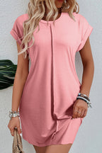 Light French beige T-shirt dress with center seam and rolled cuffs by Mommas Hive, casual and comfortable for everyday wear.