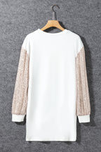 White sequin puff sleeve shift mini dress by Mommas Hive, featuring a stylish mini dress with puff sleeves and sequin embellishments.