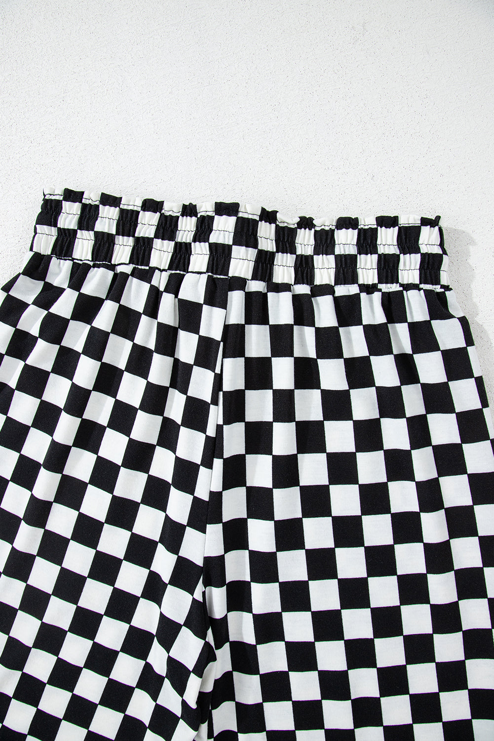 Black checkered print long sleeve top and pants lounge set by Mommas Hive, comfortable loungewear for relaxed wear.