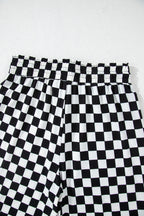 Black checkered print long sleeve top and pants lounge set by Mommas Hive, comfortable loungewear for relaxed wear.