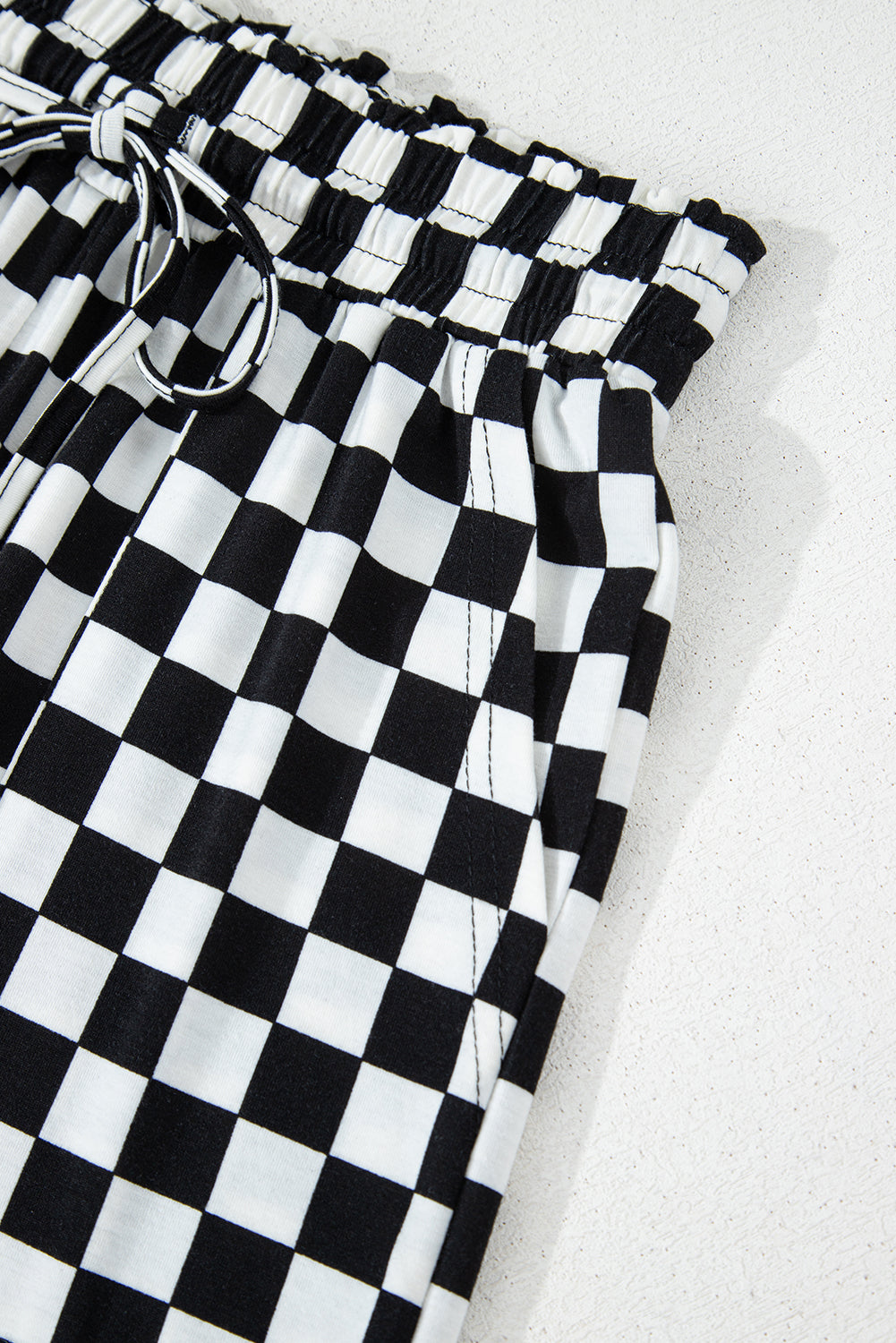 Black checkered print long sleeve top and pants lounge set by Mommas Hive, comfortable loungewear for relaxed style.