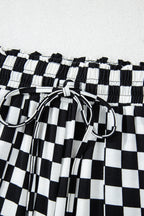 Mommas Hive black checkered print long sleeve lounge top and pants set made of polyester and elastane for comfortable loungewear.