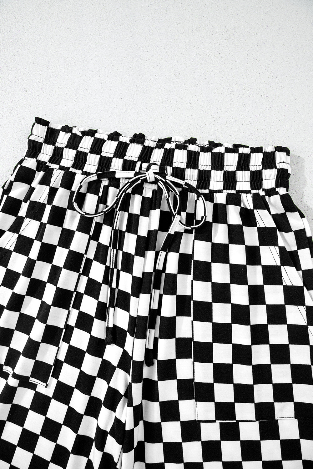 Mommas Hive black checkered print long sleeve top and pants lounge set, comfortable loungewear with a relaxed fit.