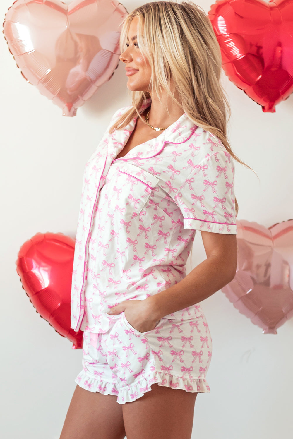 Pink bowknot printed short sleeve and ruffled shorts pajama set from Mommas Hive, perfect for Valentine's sleepwear.
