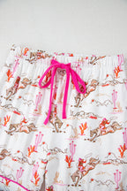 White cowgirl country print pajamas set from Mommas Hive, soft loungewear with comfortable polyester and elastane blend.