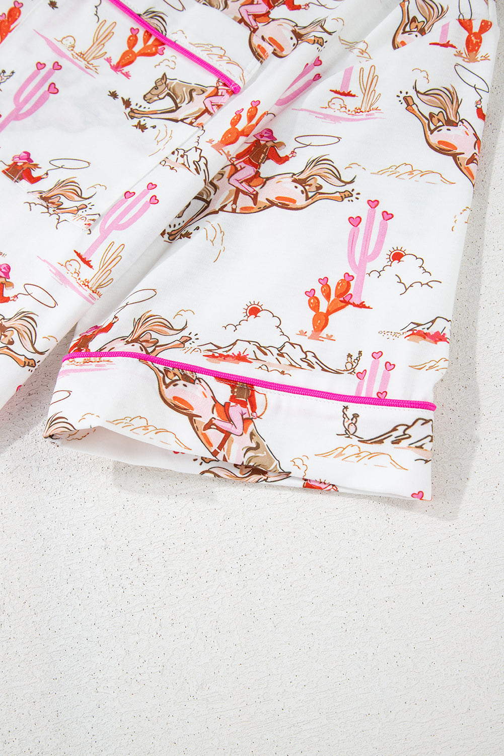 White cowgirl country print pajama set from Mommas Hive, soft loungewear with comfortable polyester and elastane blend.