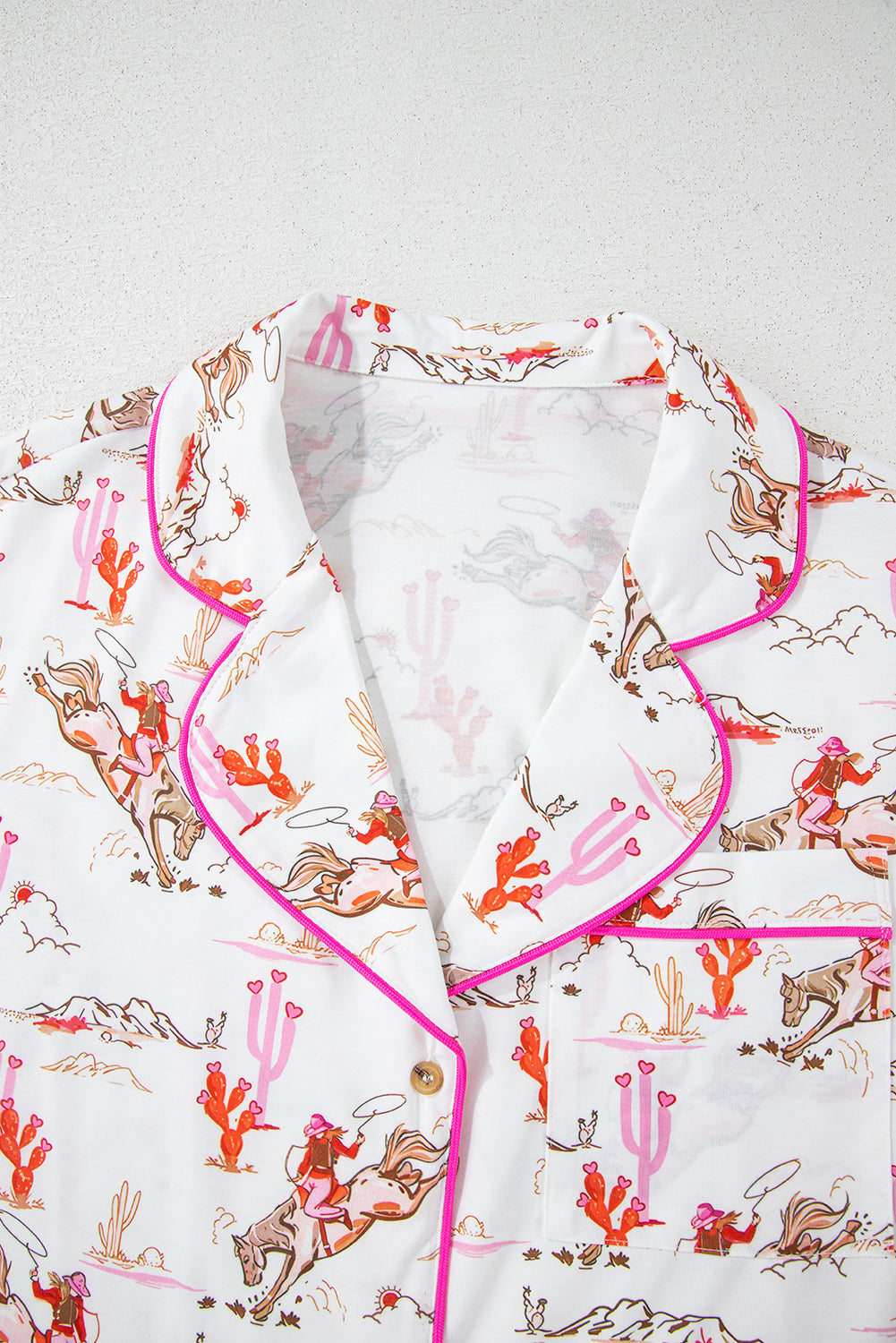White cowgirl country print pajamas set from Mommas Hive, soft loungewear with printed cowgirl design, made of polyester and elastane.