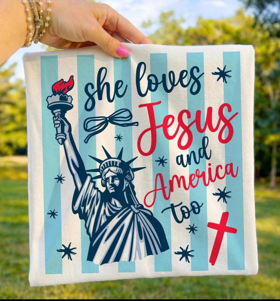 Medium-sized Houston Customs "Jesus and America Too" graphic T-shirt featuring bold text and patriotic design.