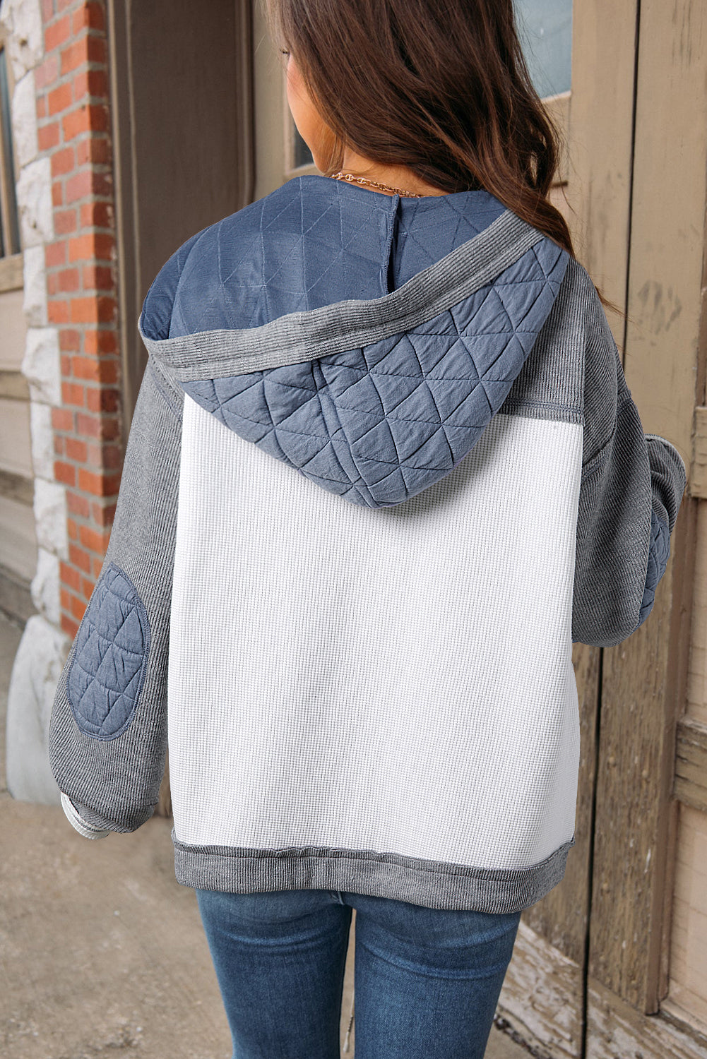 Light blue quilted textured patchwork loose fit hooded jacket by Mommas Hive, featuring a cozy outerwear design with a relaxed fit.