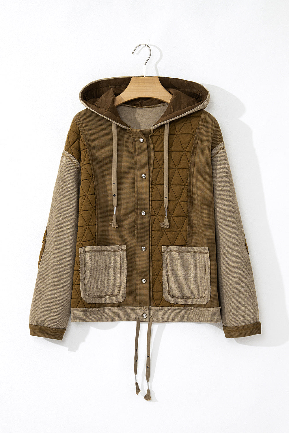 Light blue quilted textured patchwork loose-fit hooded jacket by Mommas Hive, featuring a cozy outerwear design with a relaxed fit.