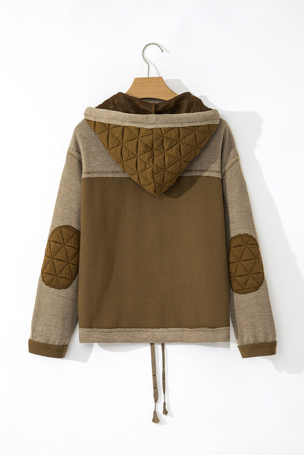 Light blue quilted textured patchwork loose-fit hooded jacket by Mommas Hive, showcasing its stylish outerwear design.
