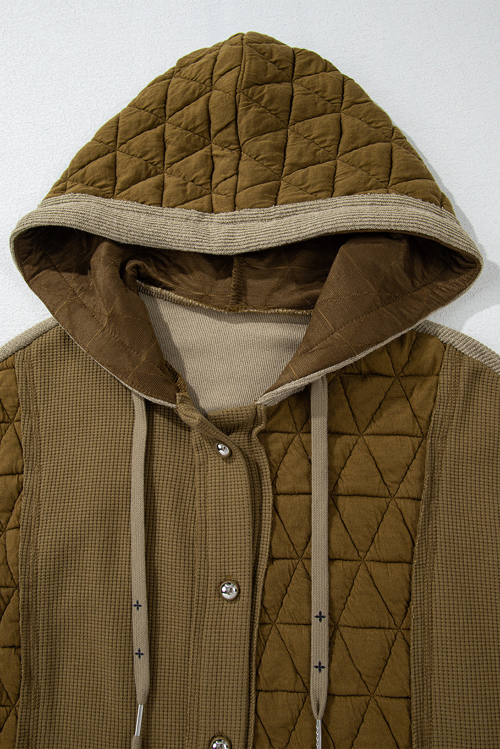 Light blue quilted textured patchwork loose fit hooded jacket by Mommas Hive, featuring a cozy outerwear design with a hood and quilted pattern.