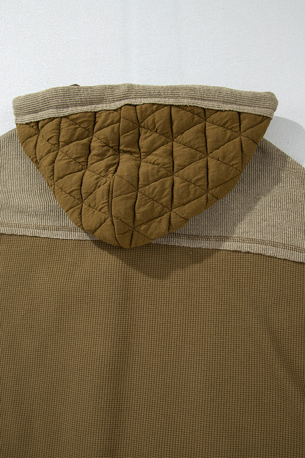 Light blue quilted textured patchwork loose fit hooded jacket by Mommas Hive, stylish outerwear with a cozy hood and relaxed fit.