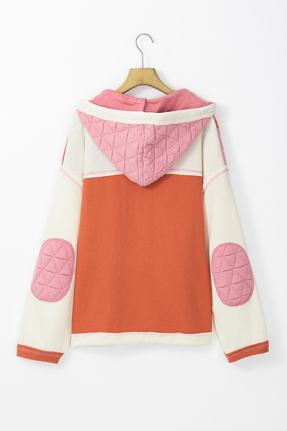 Light blue quilted textured patchwork loose-fit hooded jacket by Mommas Hive, showing the outerwear with a hood and quilted pattern.