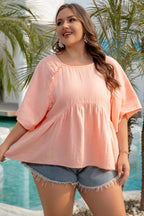 Apricot pink plus size textured babydoll blouse with wide short sleeves, made of 100% cotton, from Mommas Hive.