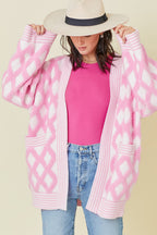 Pink rhombus pattern knit open-front cardigan with pockets from Mommas Hive, made of viscose, polyester, and polyamide.