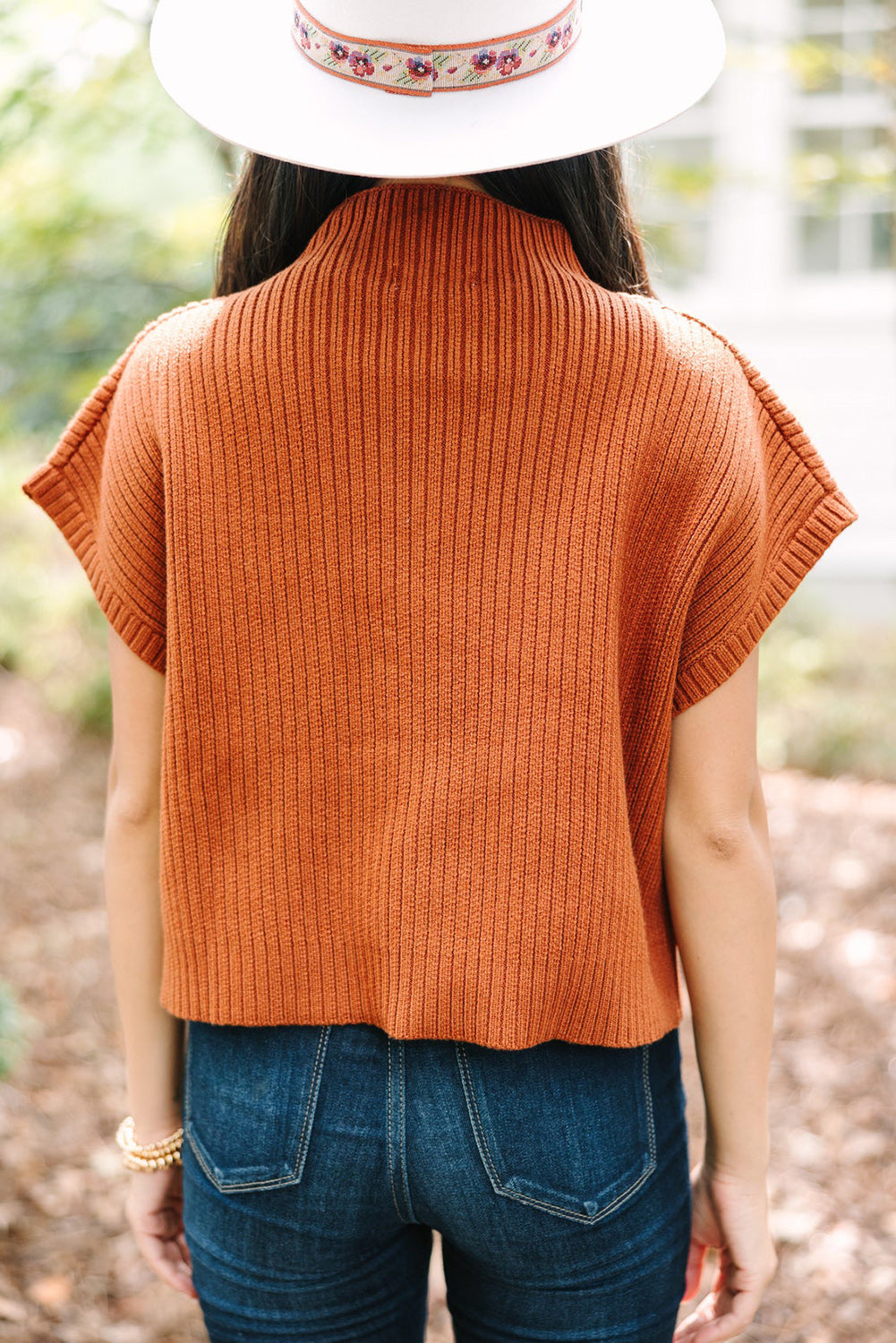 Mommas Hive oatmeal ribbed knit short sleeve sweater with patch pocket, made of viscose, polyester, and polyamide, shown on a model.