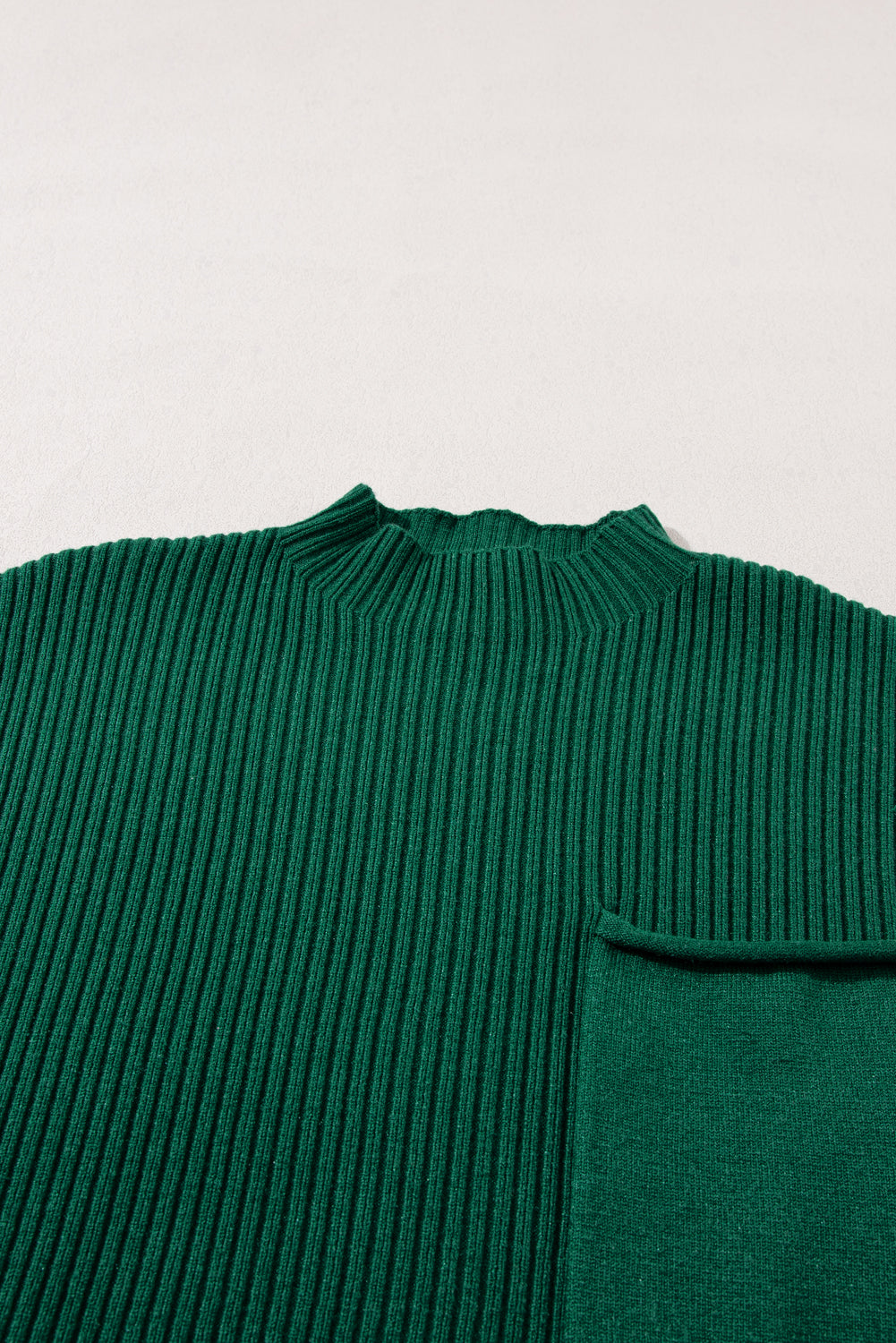 Mommas Hive oatmeal ribbed knit short sleeve sweater with patch pockets, made of viscose, polyester, and polyamide.