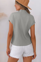Mommas Hive oatmeal ribbed knit short sleeve sweater with patch pocket, made of viscose, polyester, and polyamide.