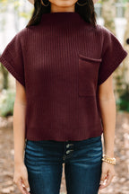 Mommas Hive oatmeal ribbed knit short sleeve sweater with patch pocket, made of viscose, polyester, and polyamide fibers.