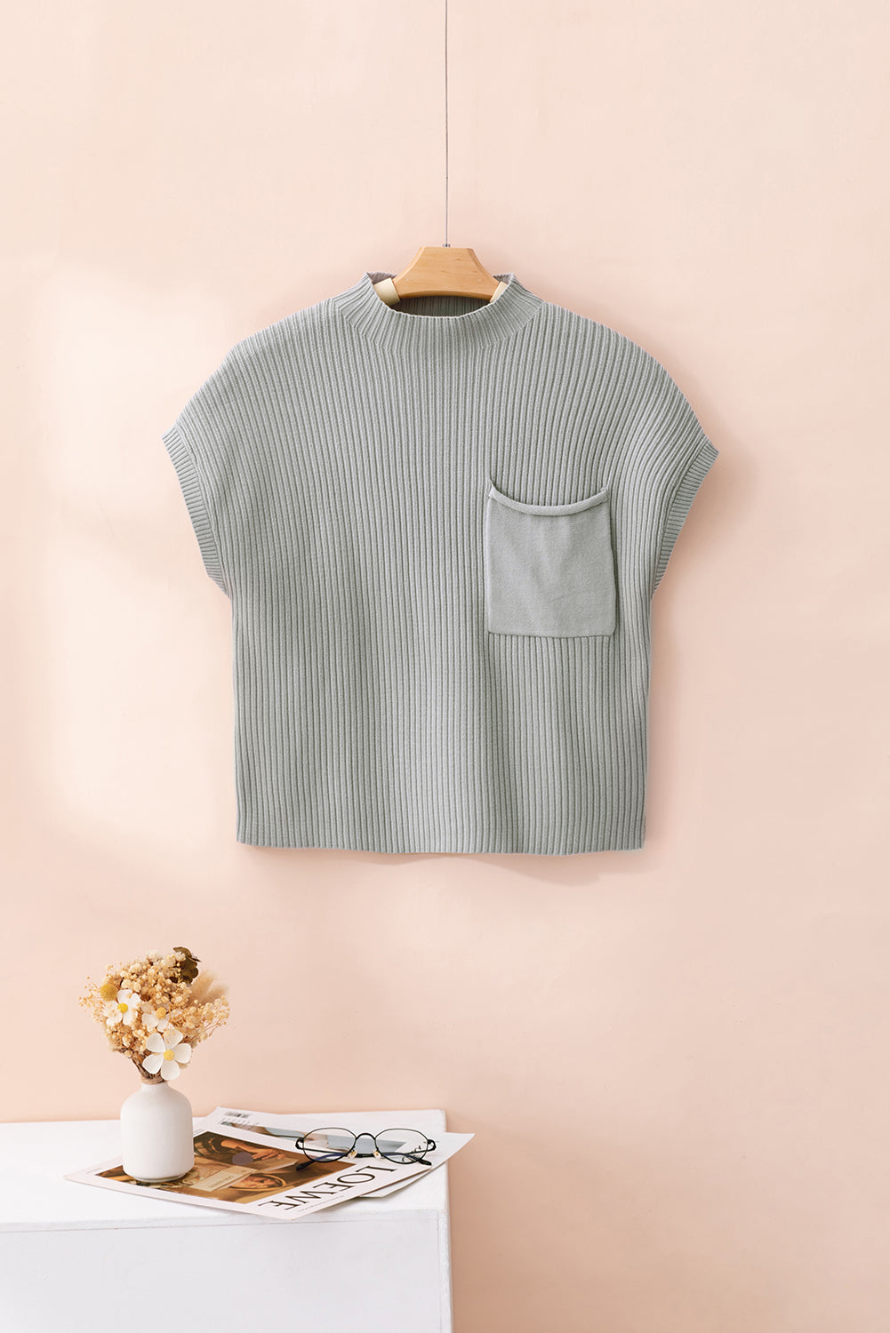 Mommas Hive oatmeal ribbed knit short sleeve sweater with patch pocket, made of viscose, polyester, and polyamide.