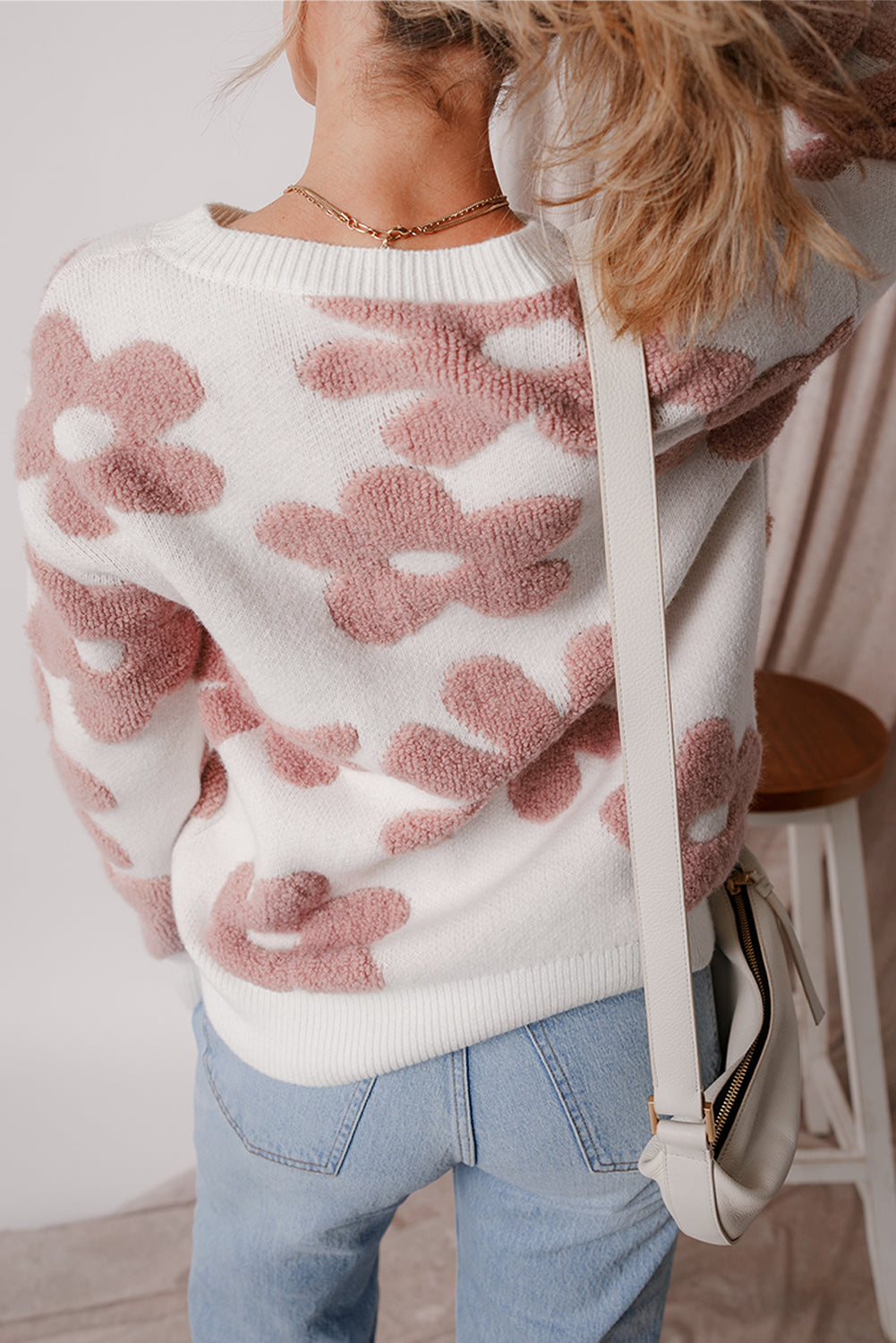 White textured flower drop shoulder loose sweater by Mommas Hive, featuring a cozy knit fabric and relaxed fit.