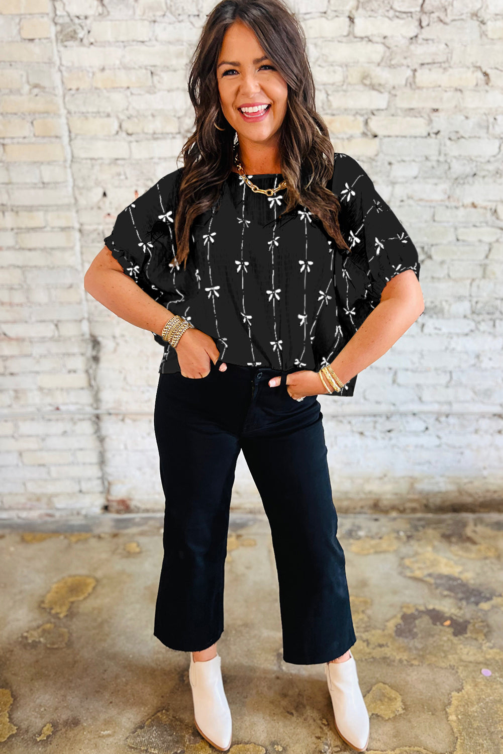 Black bow print puff short sleeve top by Mommas Hive, lightweight polyester blouse with elegant design and puff sleeves.