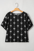 Black bow print puff short sleeve top by Mommas Hive, stylish blouse with puff sleeves and elegant bow pattern.