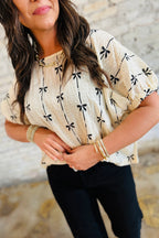Black bow print puff short sleeve top by Mommas Hive, lightweight polyester blouse with a feminine design.