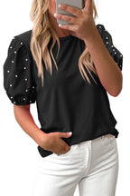 Black ribbed pearl beaded puff sleeve top from Mommas Hive, made of viscose and elastane, featuring elegant puff sleeves and beaded details.