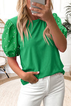 Black ribbed puff sleeve top with pearl beaded details from Mommas Hive, made of viscose and elastane, featuring a fitted silhouette.