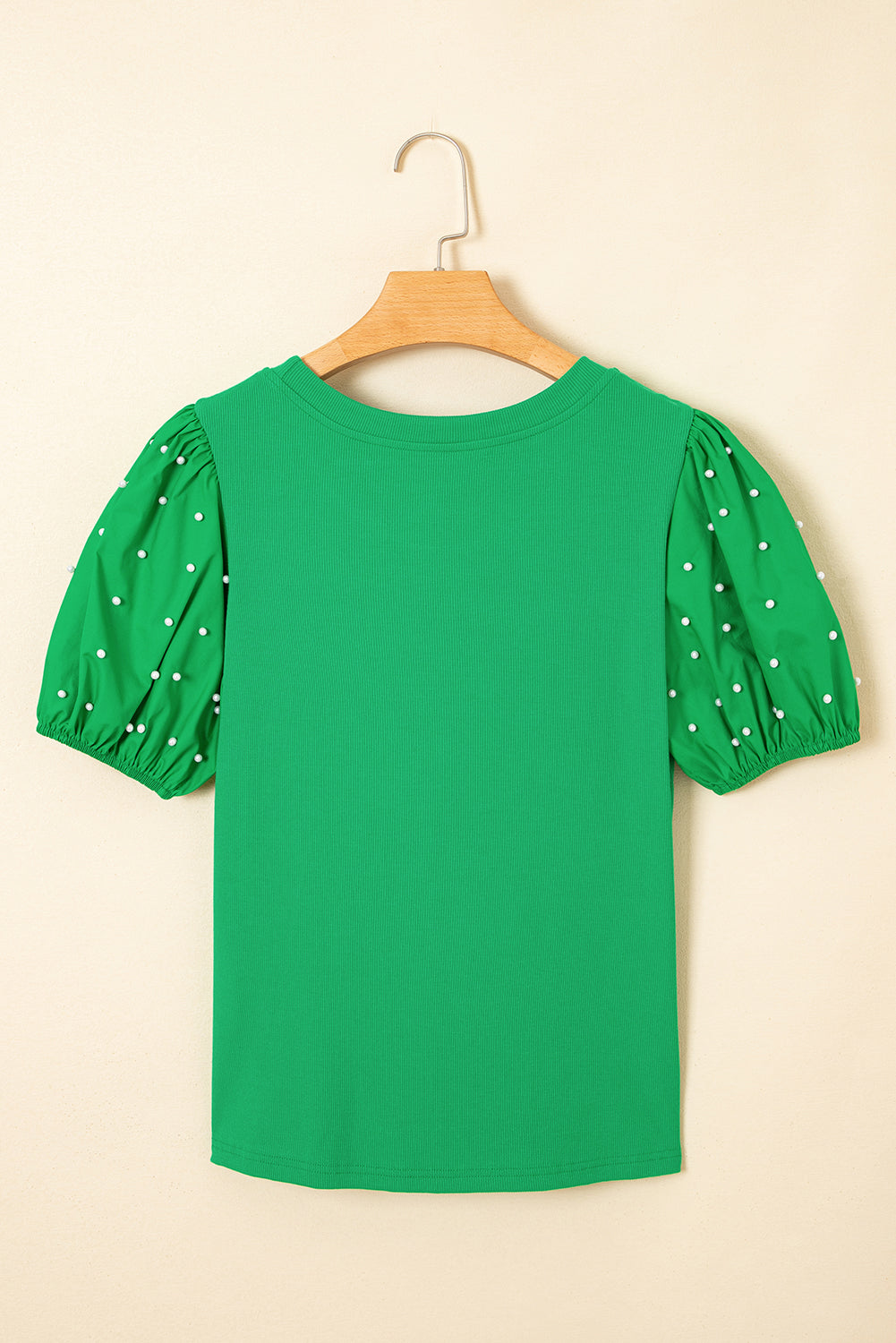 Black ribbed pearl beaded puff sleeve top by Mommas Hive, featuring textured fabric and elegant puff sleeves.