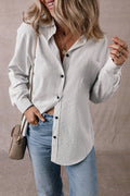 Black striped long shirt from Mommas Hive with roll-tab sleeves and chest pockets, made of polyester and cotton blend.