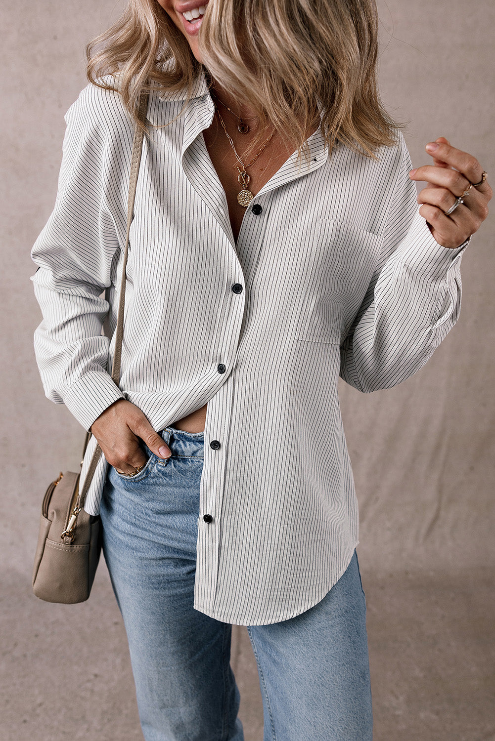 Black striped long shirt from Mommas Hive with roll-tab sleeves and chest pockets, made of polyester and cotton blend.