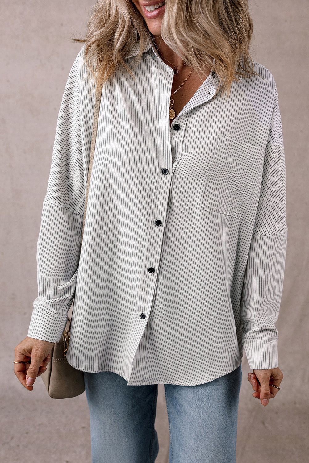Black stripe long shirt by Mommas Hive with roll-tab sleeves and front pockets, made of polyester and cotton blend.