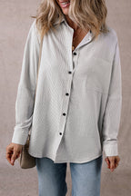 Black stripe long shirt by Mommas Hive with roll-tab sleeves and front pockets, made of polyester and cotton blend.