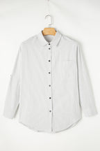 Black stripe long shirt with roll-tab sleeves and front pockets by Mommas Hive, made of polyester and cotton blend.