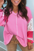 Mommas Hive Bonbon lace floral patchwork blouse with V-neck, rib knit fabric, and stitched sleeves, showcasing elegant floral details.