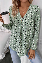Green polka dot print blouse with button front and V-neck, made by Mommas Hive, perfect for casual or smart-casual wear.