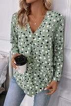 Green polka dot print blouse with button front and V-neck from Mommas Hive, perfect for casual or office wear.