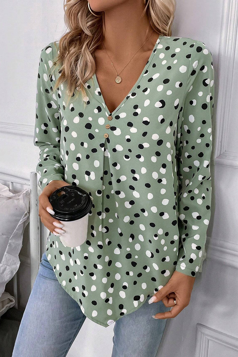 Green polka dot print blouse with button front and V-neck from Mommas Hive, perfect for casual or office wear.