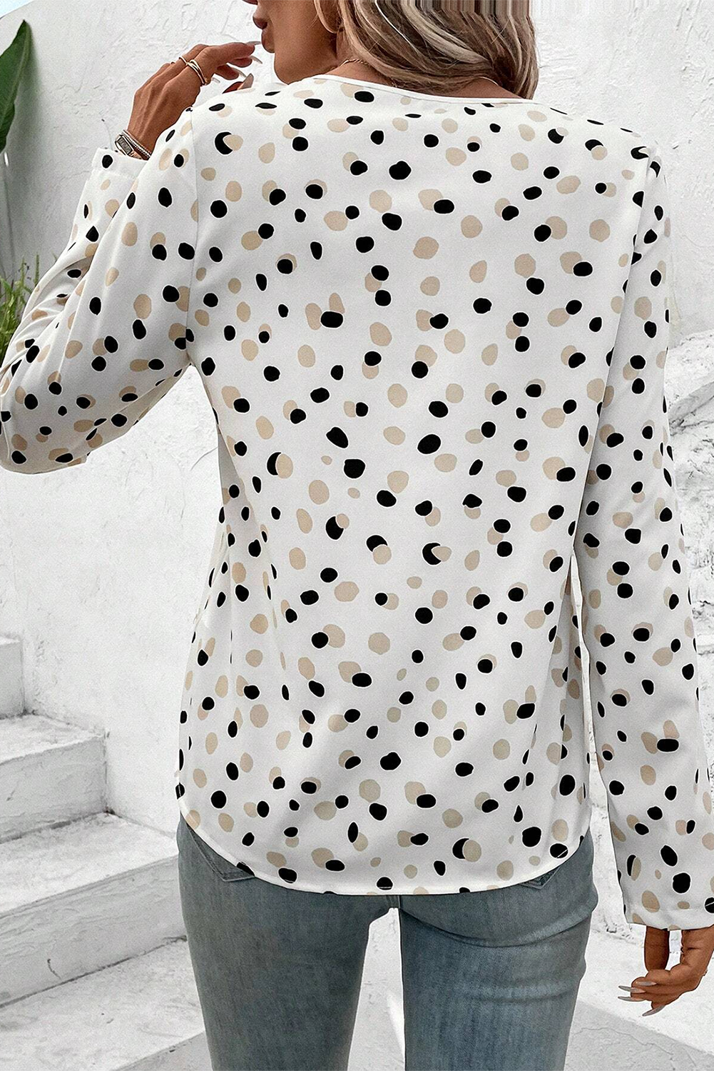 Green polka dot print blouse from Mommas Hive with button front and V-neck, made of lightweight polyester fabric.