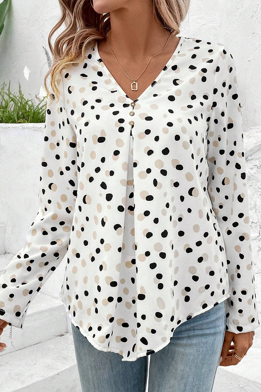Green polka dot print blouse with button front and V-neck, by Mommas Hive, made of lightweight polyester.